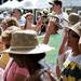 Ann Arbor Art Fair patrons try on crushable hats on South University Avenue on Saturday, July 20. Daniel Brenner I AnnArbor.com